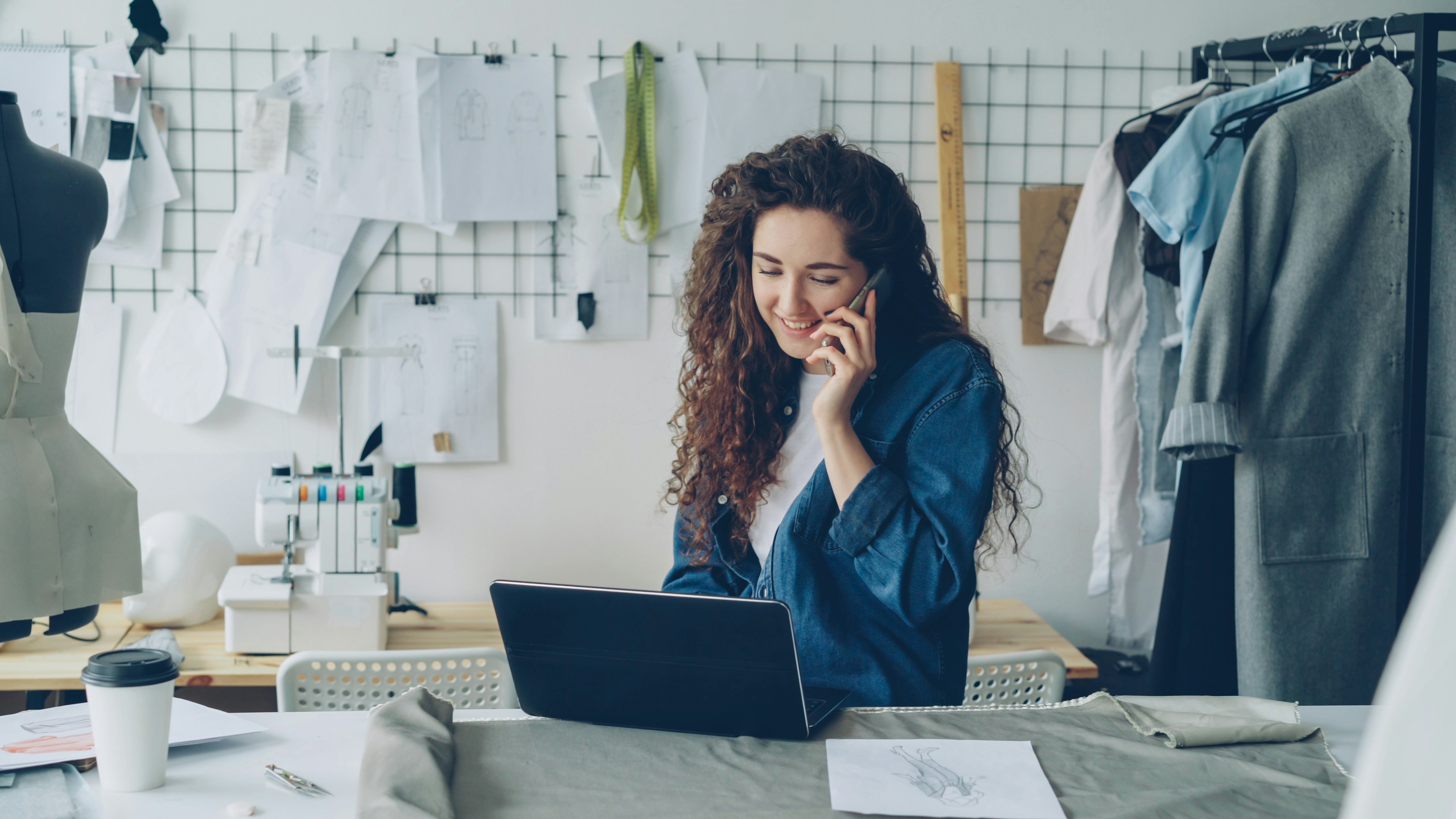 fashion-designer-on-the-phone,-working-on-a-laptop. - vitaly-gariev (unsplash)./pho
