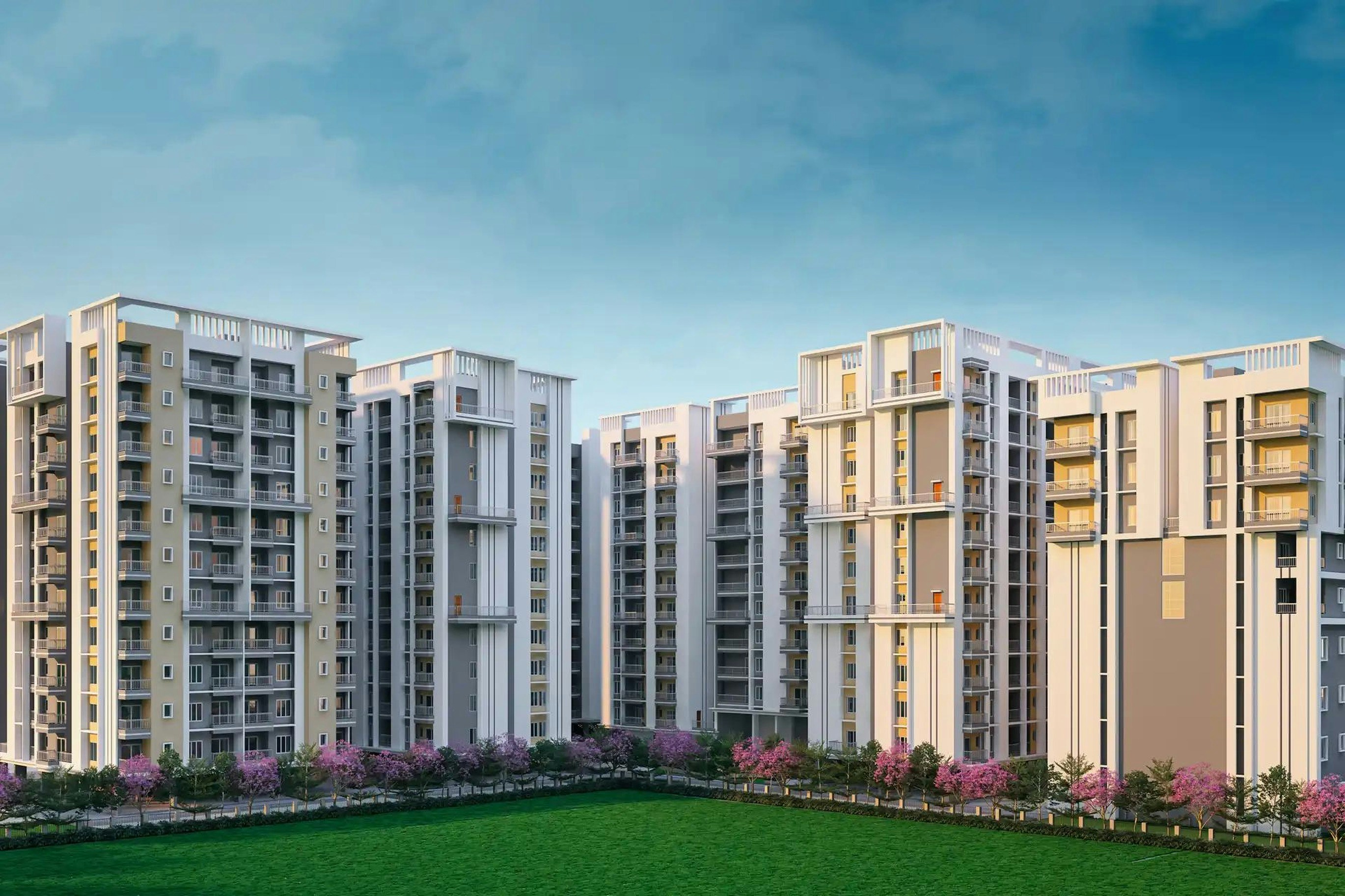 Modern apartment buildings stand against a blue sky.